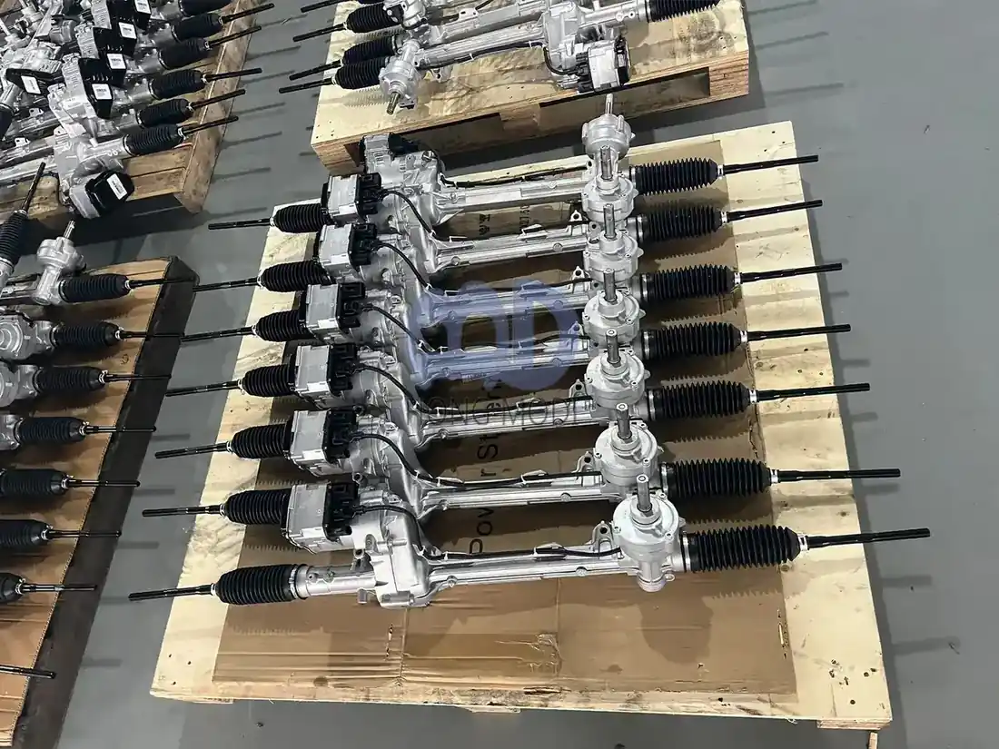 Electric power steering racks stacked in order on a wooden pallet