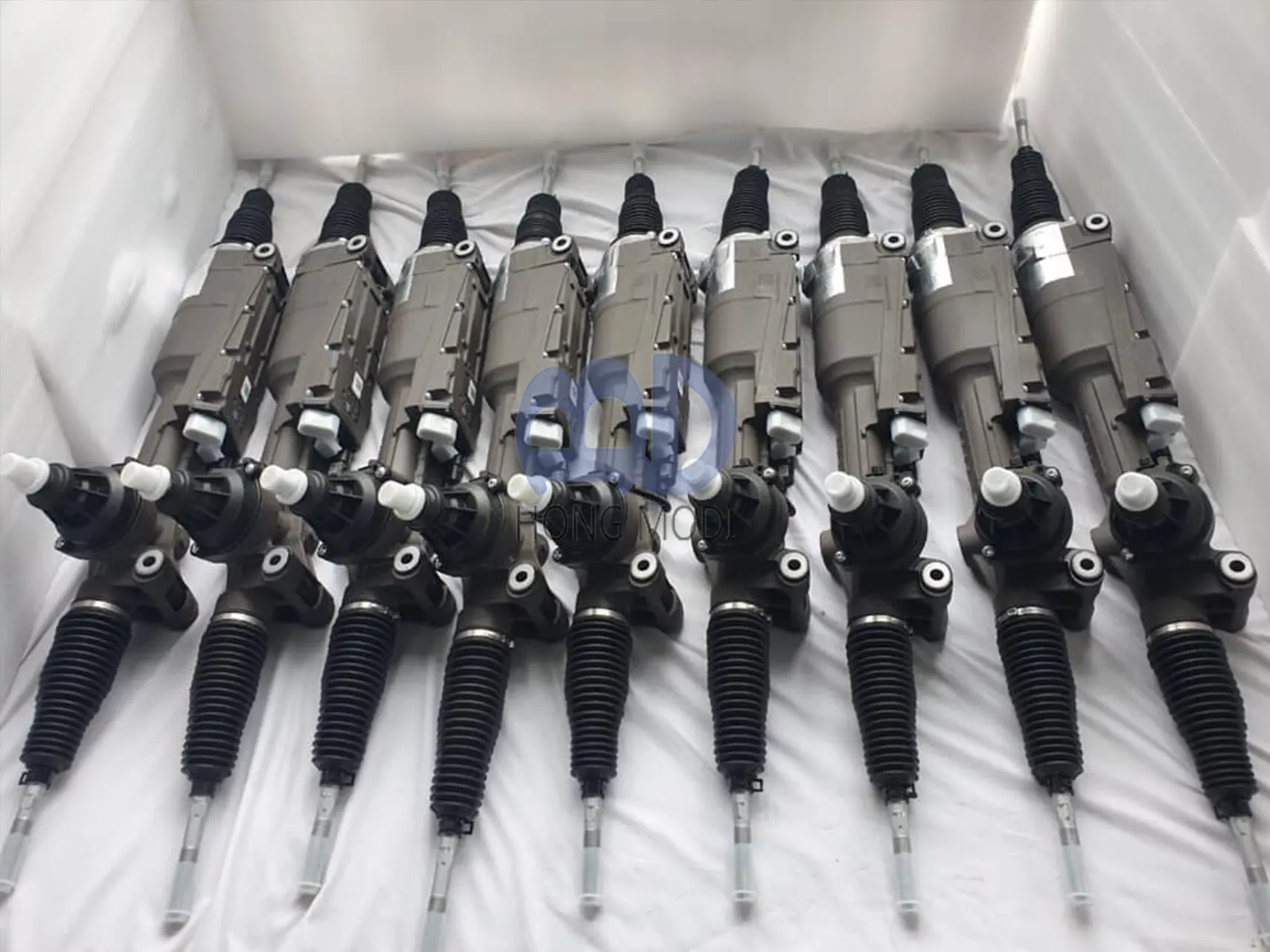 Steering racks laid out for loading into an export container