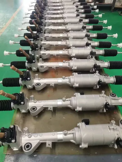 Finished steering racks arranged in a row across the work bench