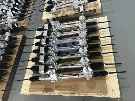 Electric power steering racks stacked in order on a wooden pallet