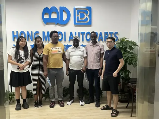 HONDMODI sales and support team photographed at the company entrance