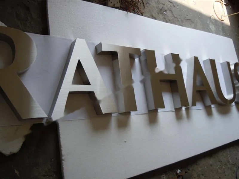 Brushed Stainless Steel relief letter sign, reference 105, photographed in the Super Enseigne workshop