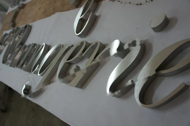 Brushed Stainless Steel box letter sign, reference 107, photographed in the Super Enseigne workshop