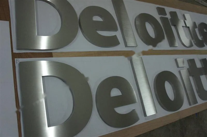 Brushed Stainless Steel relief lettering sign, reference 115, photographed in the Super Enseigne workshop