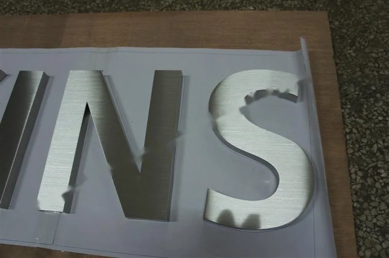 Brushed Stainless Steel box letter sign, reference 117, photographed in the Super Enseigne workshop