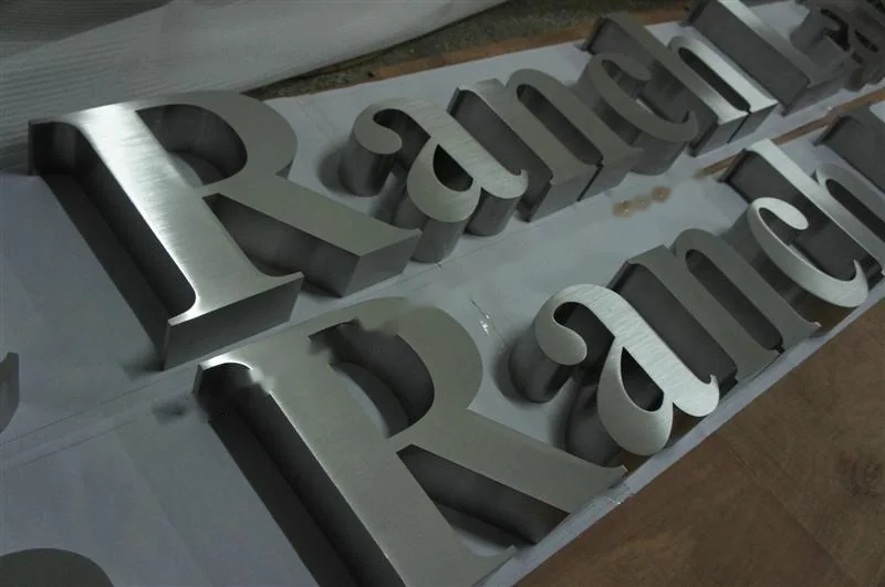 Brushed Stainless Steel box letter sign, reference 119, photographed in the Super Enseigne workshop