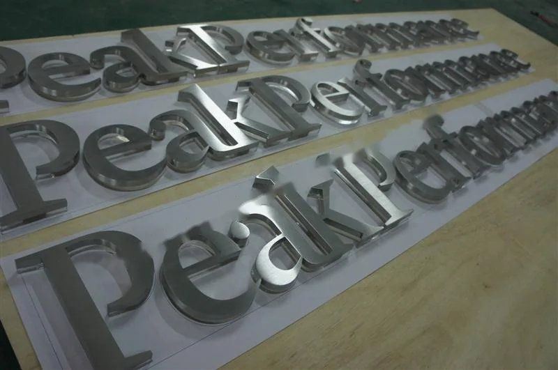 Brushed Stainless Steel relief letter sign, reference 125, photographed in the Super Enseigne workshop