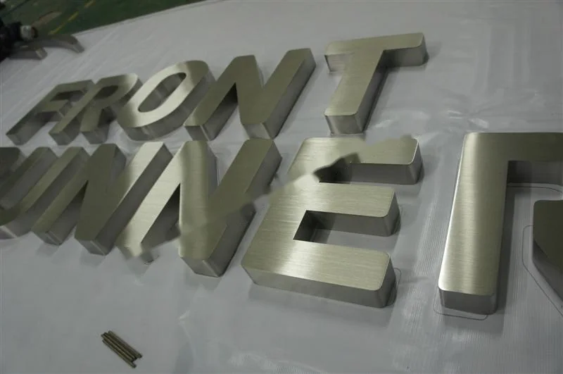 Brushed Stainless Steel relief letter sign, reference 130, photographed in the Super Enseigne workshop