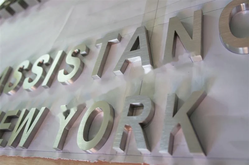 Brushed Stainless Steel relief letter sign, reference 132, photographed in the Super Enseigne workshop
