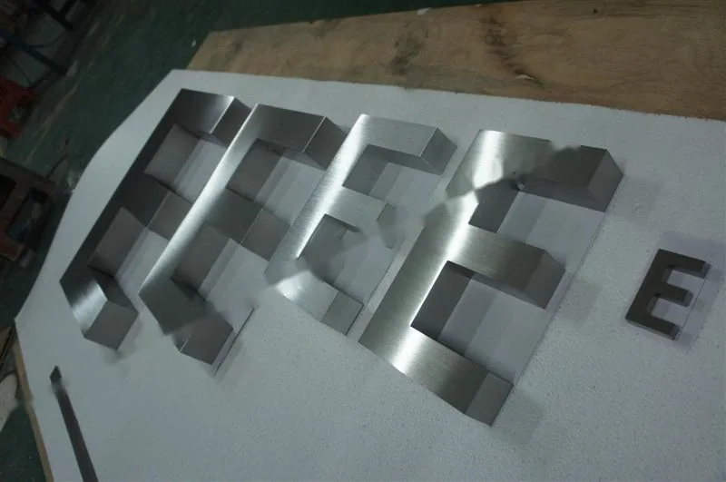 Brushed Stainless Steel box letter sign, reference 133, photographed in the Super Enseigne workshop