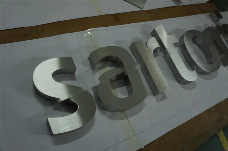 Brushed Stainless Steel relief letter sign, reference 135, photographed in the Super Enseigne workshop