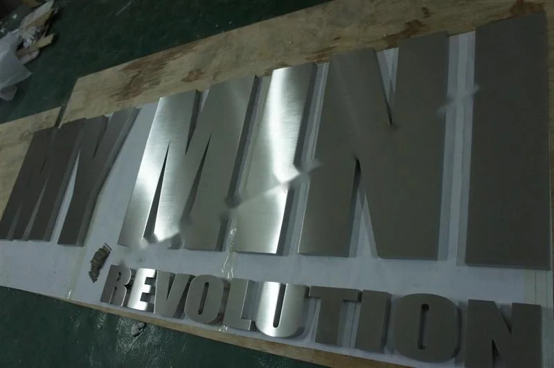 Brushed Stainless Steel relief letter sign, reference 136, photographed in the Super Enseigne workshop