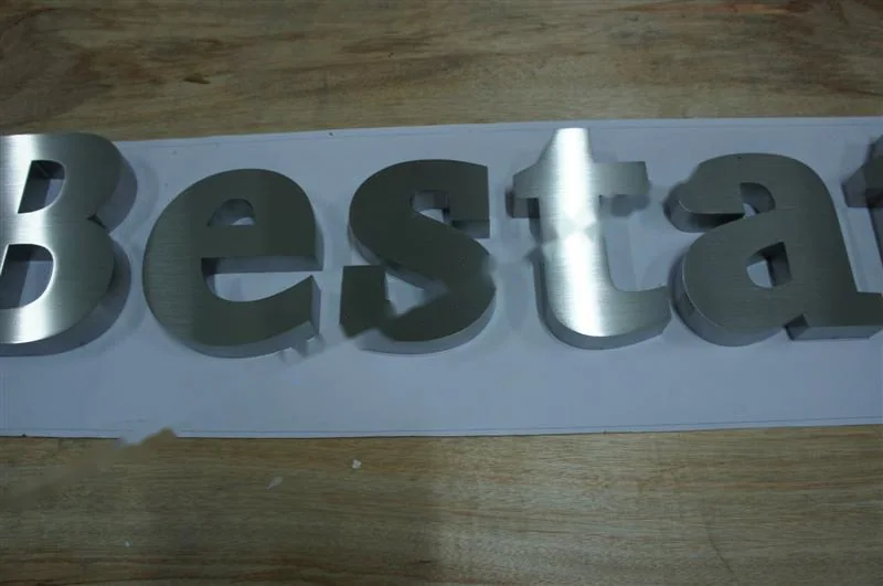 Brushed Stainless Steel relief lettering sign, reference 138, photographed in the Super Enseigne workshop