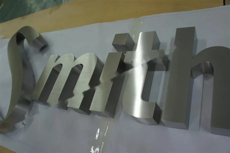 Brushed Stainless Steel relief letter sign, reference 139, photographed in the Super Enseigne workshop