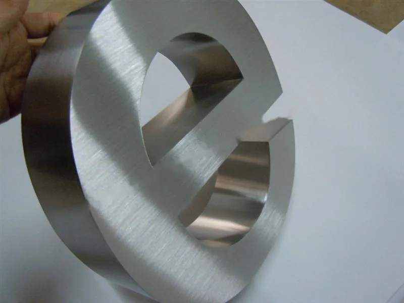 Brushed Stainless Steel relief letter sign, reference 142, photographed in the Super Enseigne workshop