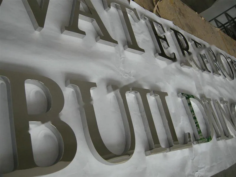 Mirror Polished Stainless Steel relief lettering sign, reference 206, photographed in the Super Enseigne workshop
