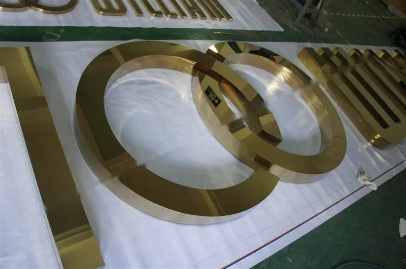 Mirror Polished Stainless Steel relief lettering sign, reference 217, photographed in the Super Enseigne workshop