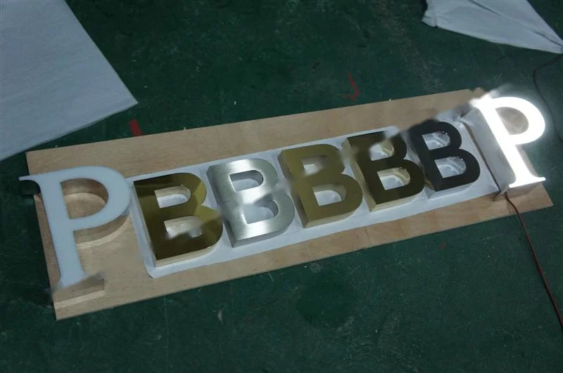 Mirror Polished Stainless Steel relief lettering sign, reference 224, photographed in the Super Enseigne workshop