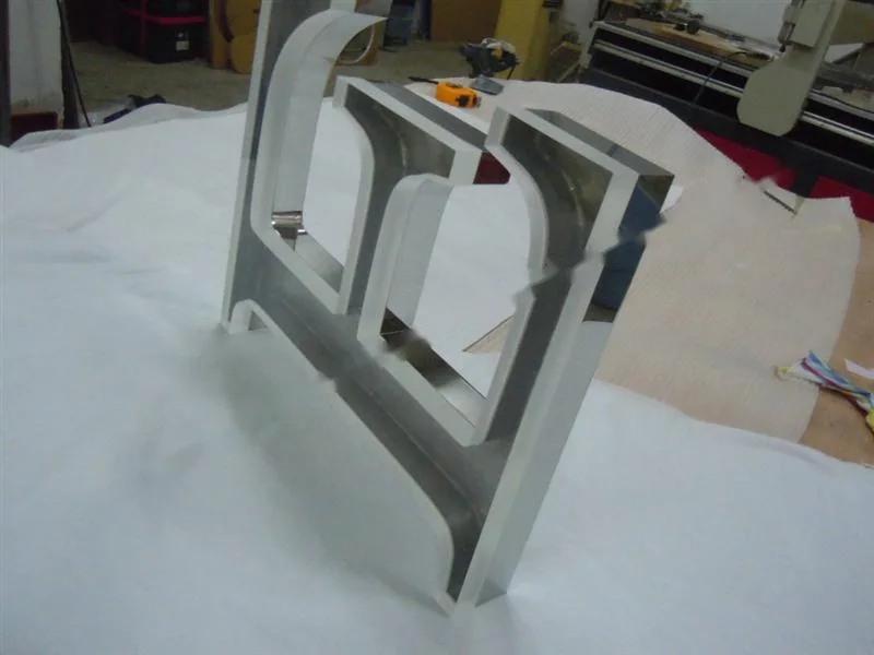 Metal sign letters on the workshop bench before finishing