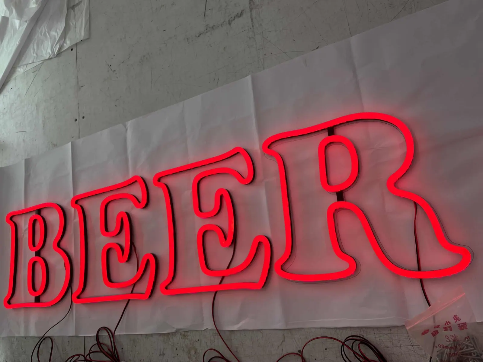 Halo-lit metal sign letters installed on an interior wall