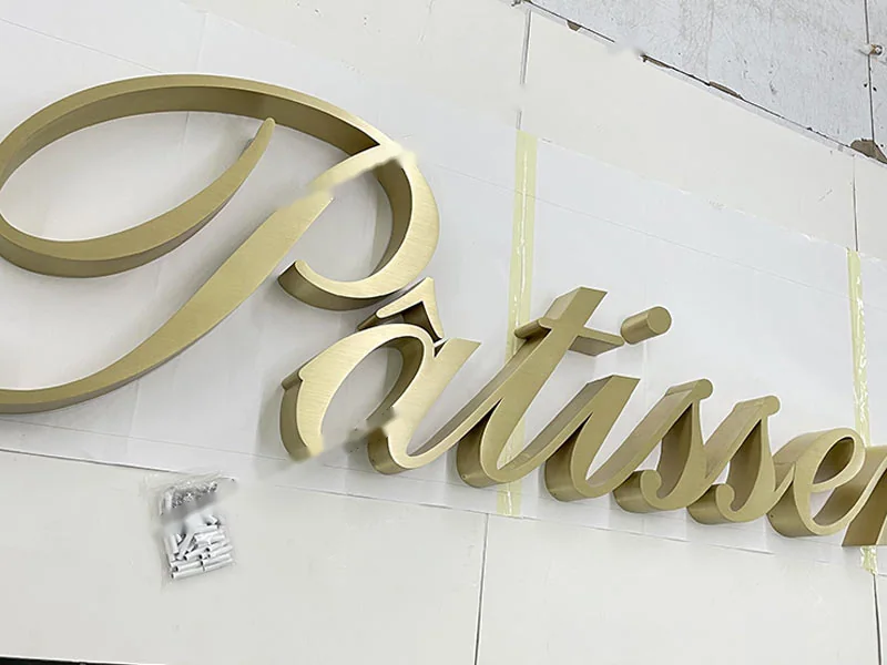 Installed metal sign letters on a commercial building