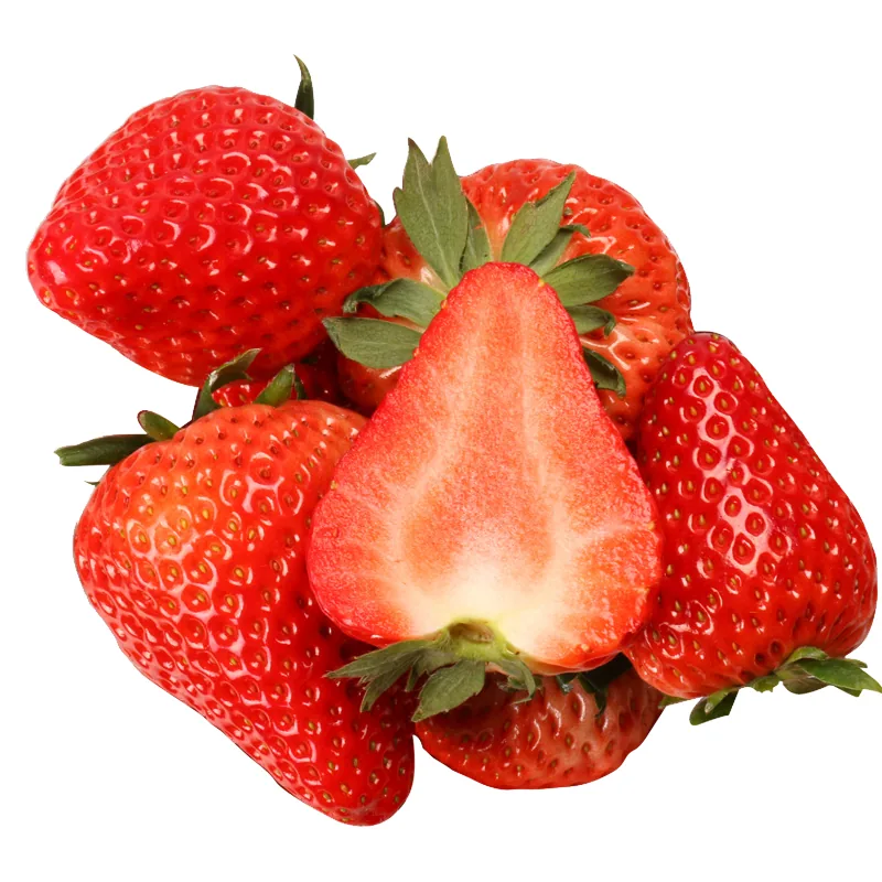 Fresh whole strawberries with one halved berry showing juicy red flesh, isolated on white background