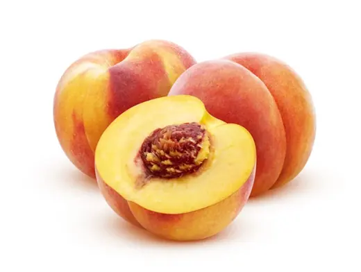 Two whole peaches and a halved peach with visible pit on a white background