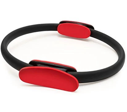 Black Pilates ring with red contoured grips