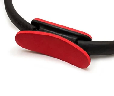 Close view of the red contoured grip pad on the Pilates ring