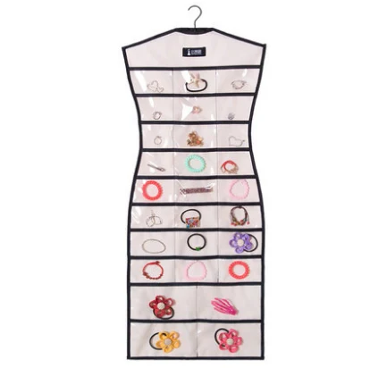 Beige dress shaped hanging jewelry organizer filled with rings and earrings