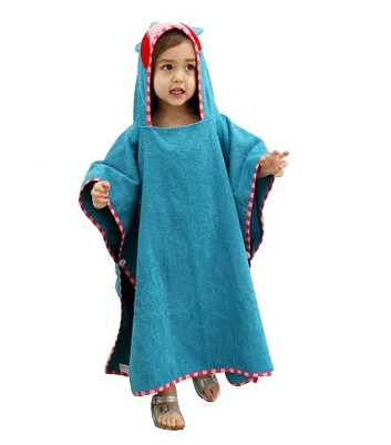 Child wearing a blue hooded towel with a stitched character hood