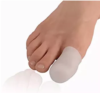 Silicone gel toe cap being fitted over a big toe