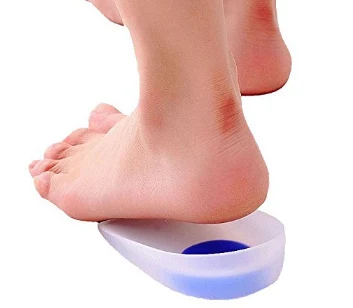 Silicone heel cushion shown under a heel demonstrating the soft centre