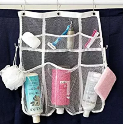 Hanging mesh shower caddy with bottles in open pockets against a dark wall
