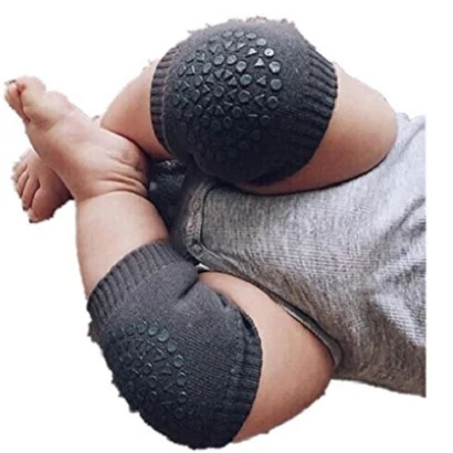 Baby wearing grey padded anti slip crawling knee sleeves