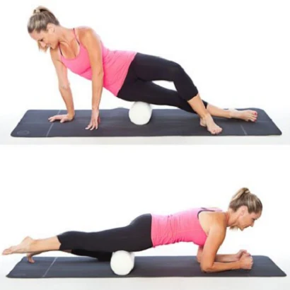 Woman using a foam roller on a mat during a recovery exercise