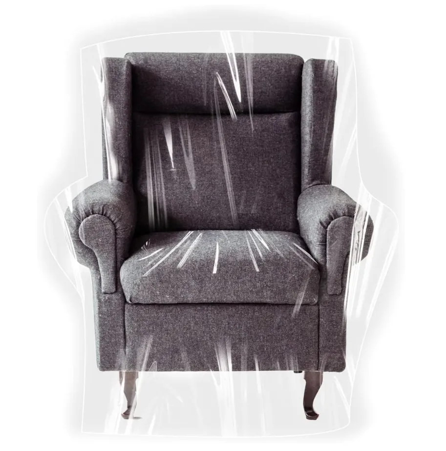 Clear protective cover fitted over a wing armchair