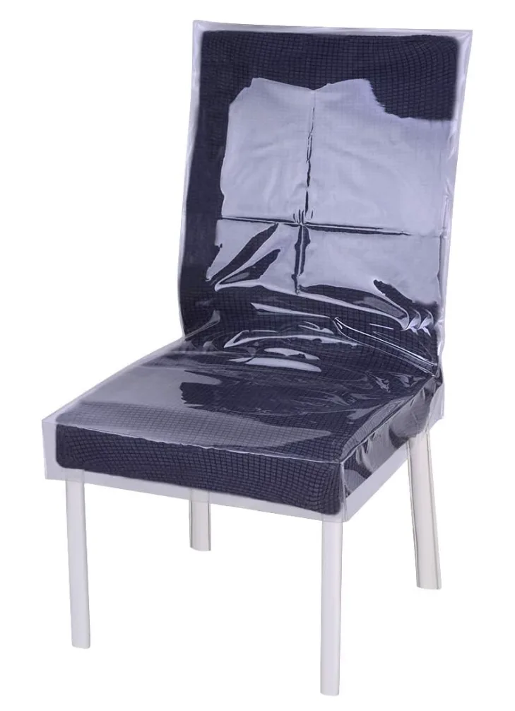 Clear PVC dining chair cover with printed dimensions on a dark chair
