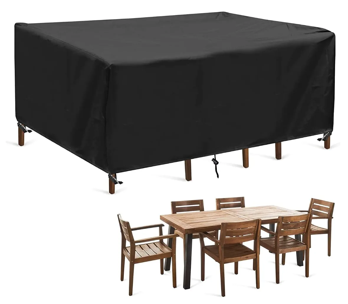 Black rectangular patio furniture cover over a garden table set