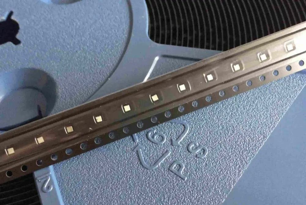 Thermoelectric pellets on a taping strip beside a scale rule