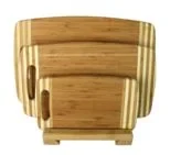 Graduated bamboo cutting board set held upright in a matching bamboo stand