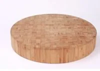 Thick round bamboo chopping block showing the end grain block pattern