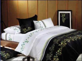 TD-258 white bedding set with a black embroidered leaf border and black accent pillows