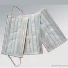 Blue nonwoven bouffant surgical cap and white nonwoven strip cap