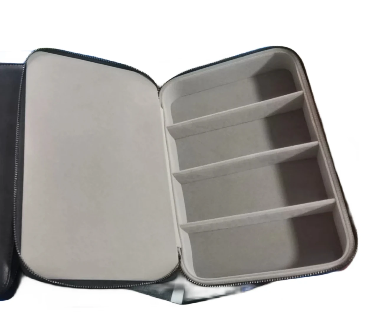 Hard eyewear travel case open beside a soft leather pouch
