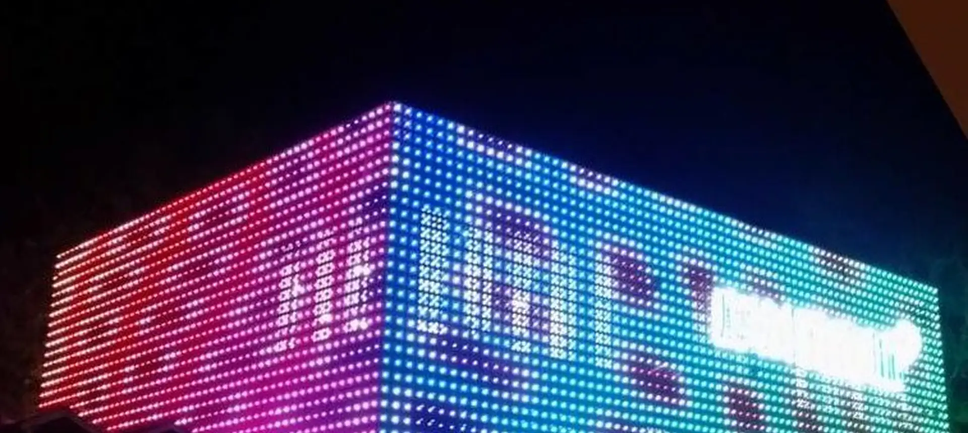 Commercial building running full colour video content on an LED dot light matrix facade