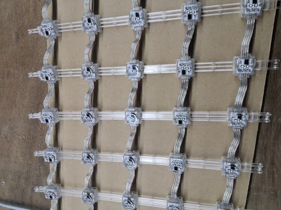 Mesh pixel strings laid out and boxed in the packing area before shipment