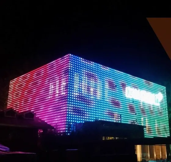 Commercial building facade running full colour video on an LED RGB dot light matrix