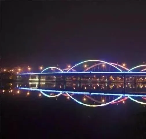 River bridge arches outlined with colour changing LED light lines