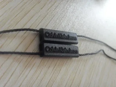 String Tag in Calvin Klein with Black Bead supplied by BY Boyuan